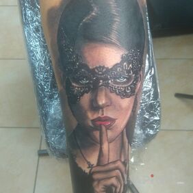 Tattoo Woman in a mask on the forearm motif: faces style: realistic