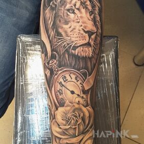 Tattoo Lion, clock, rose on the forearm motif: objects style: realistic