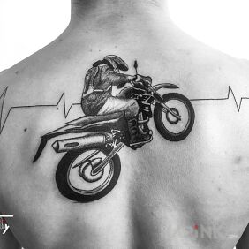Tattoo Motek on the back motif: characters