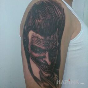 Tattoo Joker ? on the upper arm motif: characters