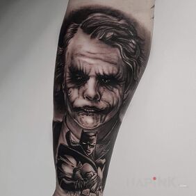 Tattoo Joker on the forearm motif: faces style: realistic