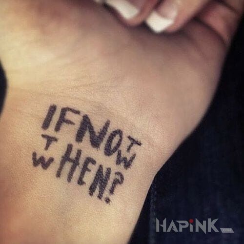 Tattoo Kwestia czasu in lettering motif on the wrist