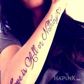 Tattoo Love on the forearm motif: lettering