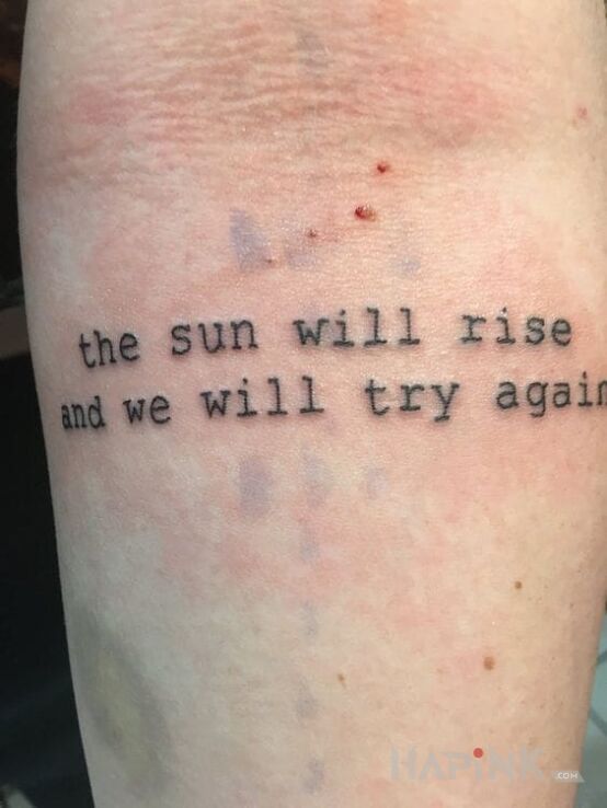 Tattoo Napis po angielsku in lettering motif on the forearm