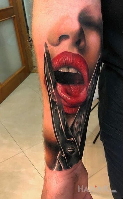 Tattoo Nozyczki in faces motif and realistic style on the forearm