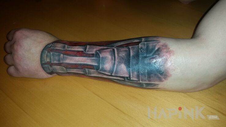 Tattoo Jak widać na foto kto bystry ten zobaczy in biomechanics style on the forearm