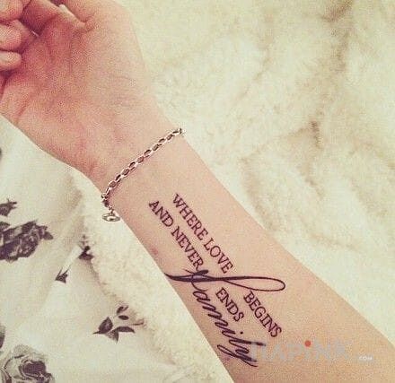 Tattoo Rodzina in lettering motif on the forearm