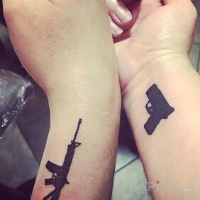 Tattoo Guns on the wrist motif: Love