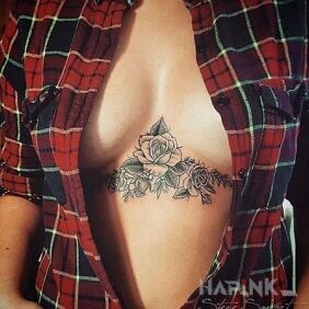 Tattoo Rose on the bridge underboob motif: sexy