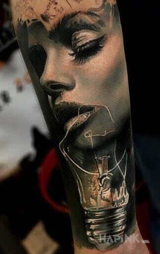 Tattoo Kobieca twarz in faces motif and realistic style on the forearm