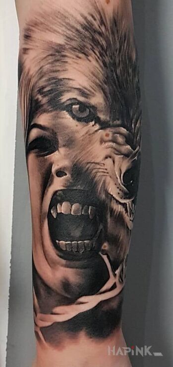 Tattoo #wampire #wolf #tatoo in characters motif and realistic style on the forearm