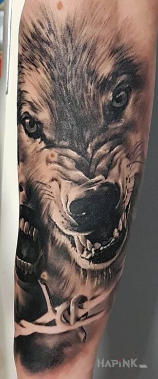 Tattoo #wampire #wolf #tatoo in animals motif and realistic style on the forearm