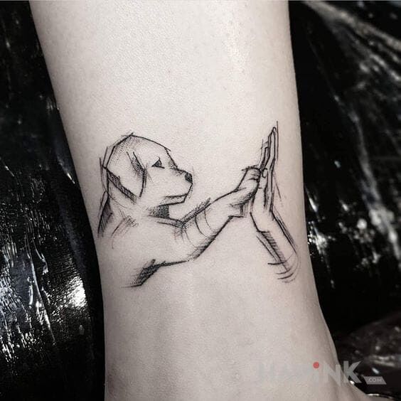 Tattoo Piesek in animals motif on the leg