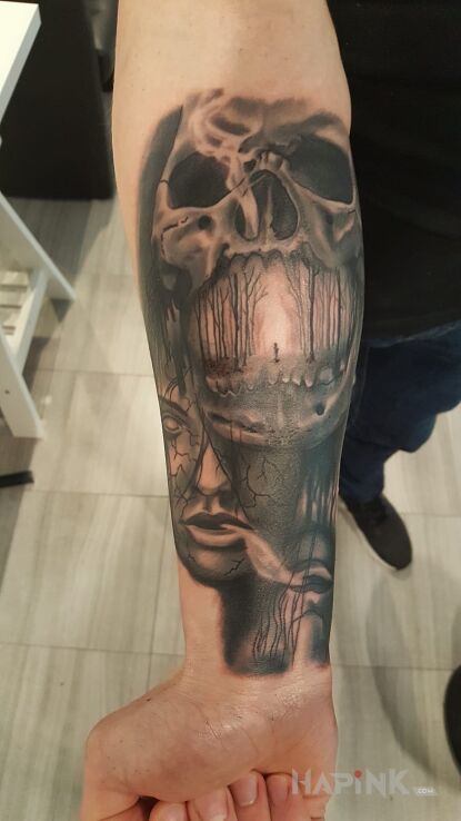Tattoo Skull in skulls motif on the forearm