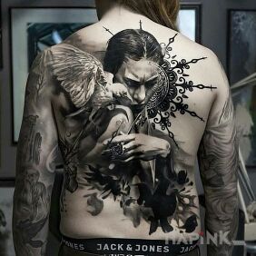 Tattoo Bird on the shoulder on the back motif: faces style: realistic