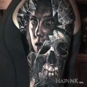 Tattoo The face behind the glass on the upper arm motif: skulls style: realistic