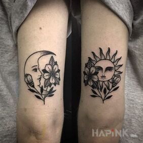 Tattoo Day and night on the upper arm motif: flowers