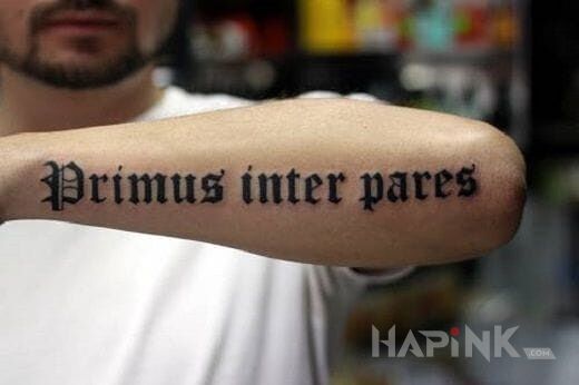 Tattoo Łacina in lettering motif on the forearm