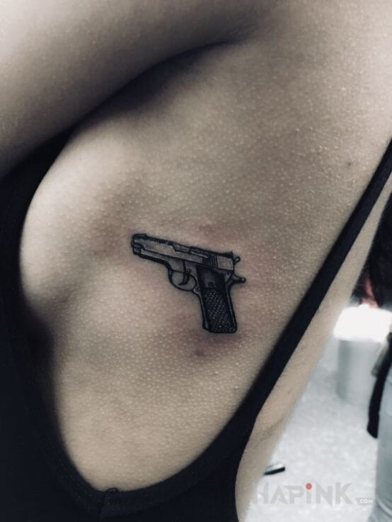 Tattoo Gnat in objects motif on the ribs