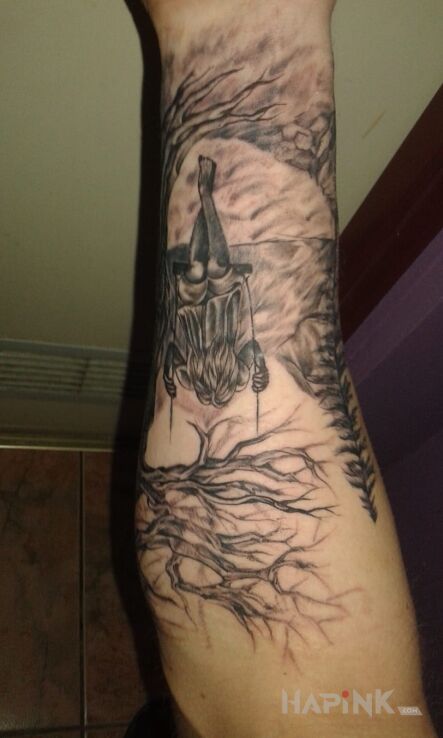 Tattoo Hhhe in demons motif on the forearm