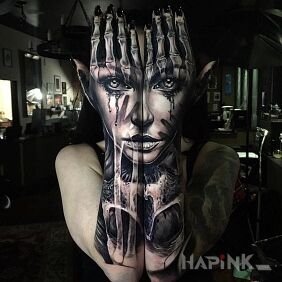 Tattoo Face on the forearm motif: faces