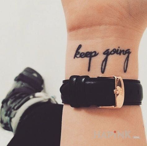 Tattoo Keep going in lettering motif on the wrist