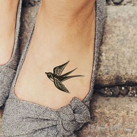 Tattoo Swallow on the foot motif: animals