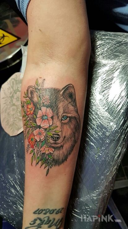 Tattoo Mój wilczek in animals motif on the forearm