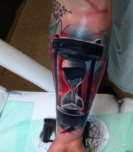 Tattoo Klepsydra in colorful motif and realistic style on the forearm