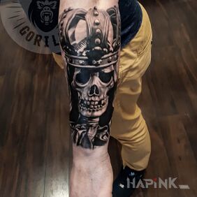 Tattoo Crowned skull on the forearm motif: 3D style: realistic