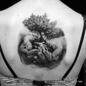 Tattoo Tree in the hands on the back motif: 3D style: realistic