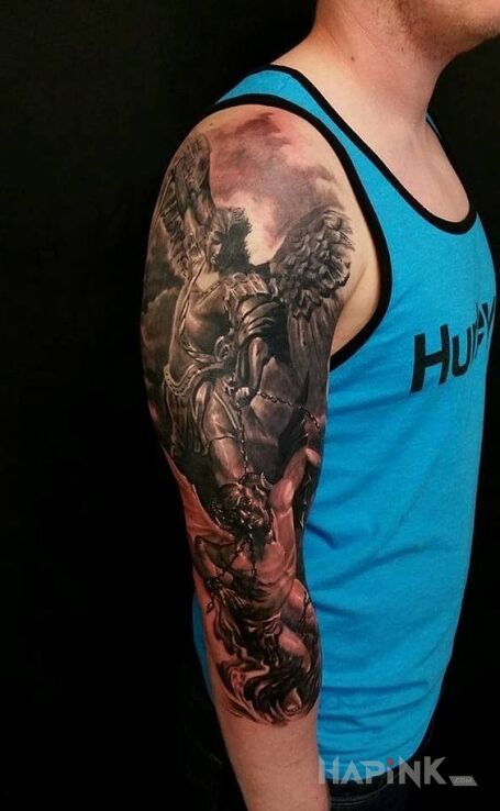 Tattoo Walka z demonem in angels motif on the forearm