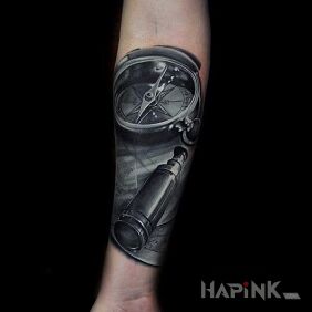 Tattoo Compass and telescope on the forearm motif: 3D style: realistic
