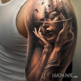 Tattoo A thoughtful woman on the upper arm motif: faces style: realistic