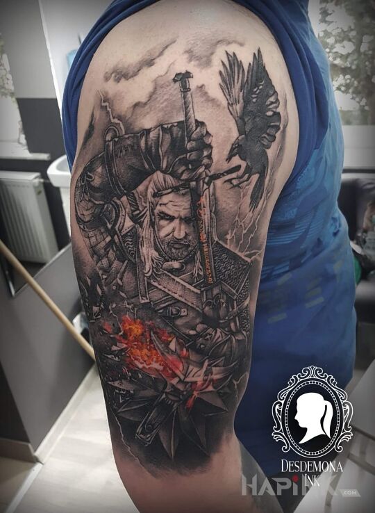 Tattoo Wiedźmin. Biały Wilk in characters motif on the upper arm