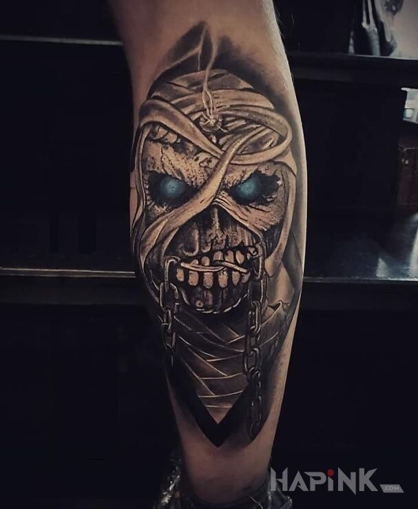 Tattoo Powerslave in demons motif on the calf