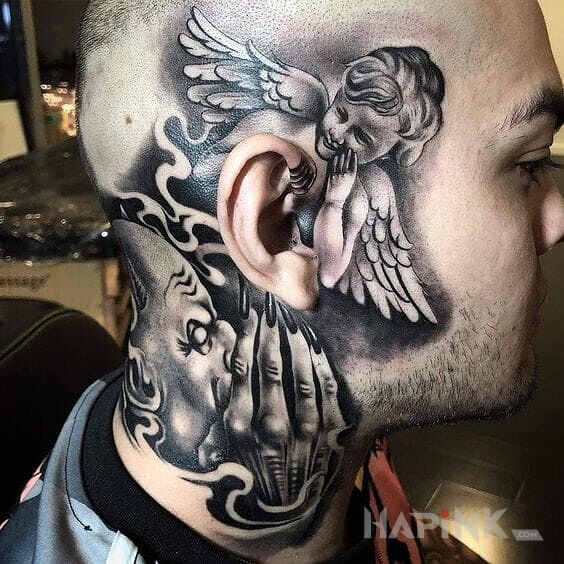 Tattoo Diabelskie podszepty in angels motif on the neck