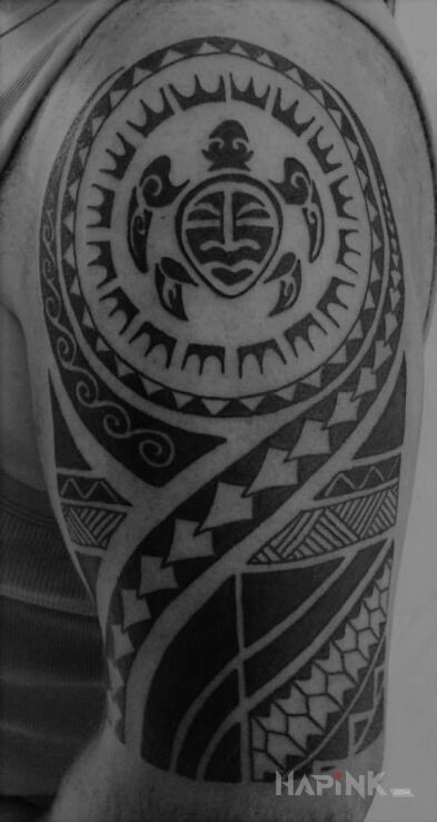 Tattoo Maori tattoo in animals motif and Polynesian style on the upper arm
