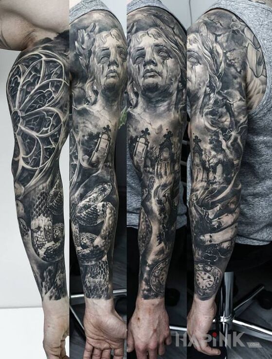 Tattoo Waz i cmentarz in animals motif and realistic style on the upper arm