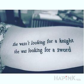 Tattoo What was she looking for? on the upper arm motif: lettering