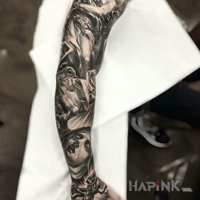 Tattoo Religious sleeve on the upper arm motif: faces