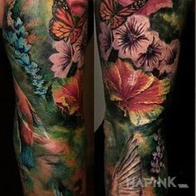 Tattoo Colorful and realistic on the upper arm motif: colorful style: realistic