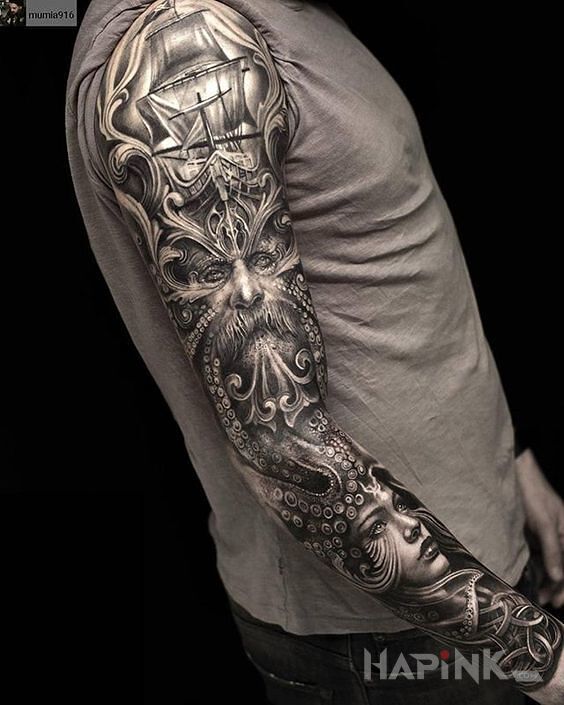 Tattoo Wilki morskie in faces motif and realistic style on the upper arm
