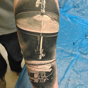 Tattoo Drums tattoo on the forearm style: realistic