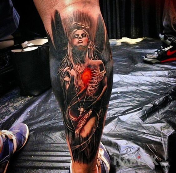 Tattoo Mroczny anioł in colorful motif on the calf