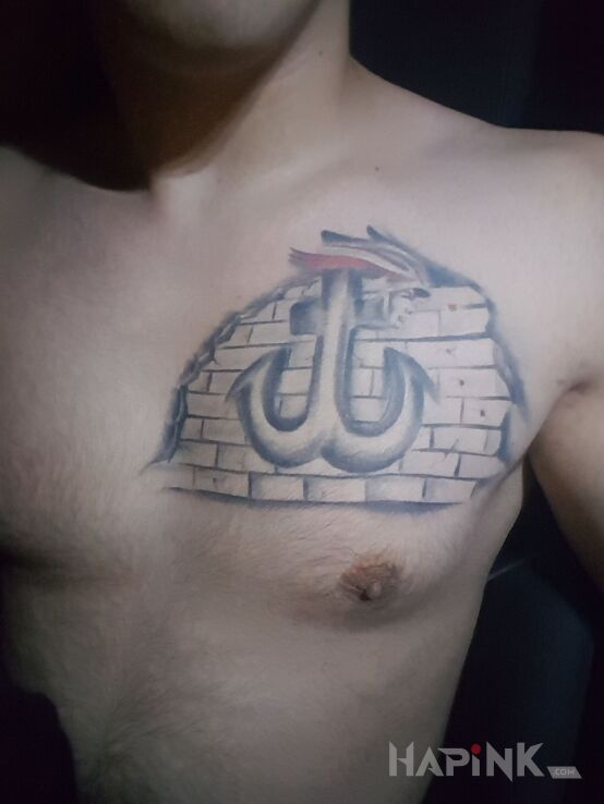 Tattoo POLSKA WALCZĄCA in patriotic motif on the chest