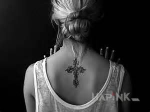 Tattoo Krzyż in religious motif on the back