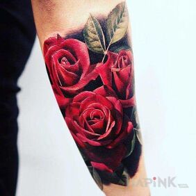 Tattoo Red roses on the forearm motif: colorful style: realistic
