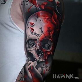 Tattoo Life & Death on the upper arm motif: skulls