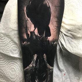 Tattoo Raven on the skull on the forearm motif: skulls style: realistic